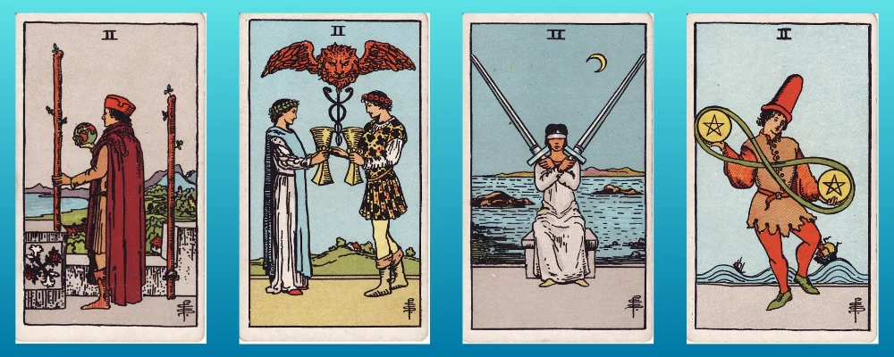 Tarot pip cards in a row - Two of Pentacles, Two of Cups, Two of Swords and Two of Pentacles